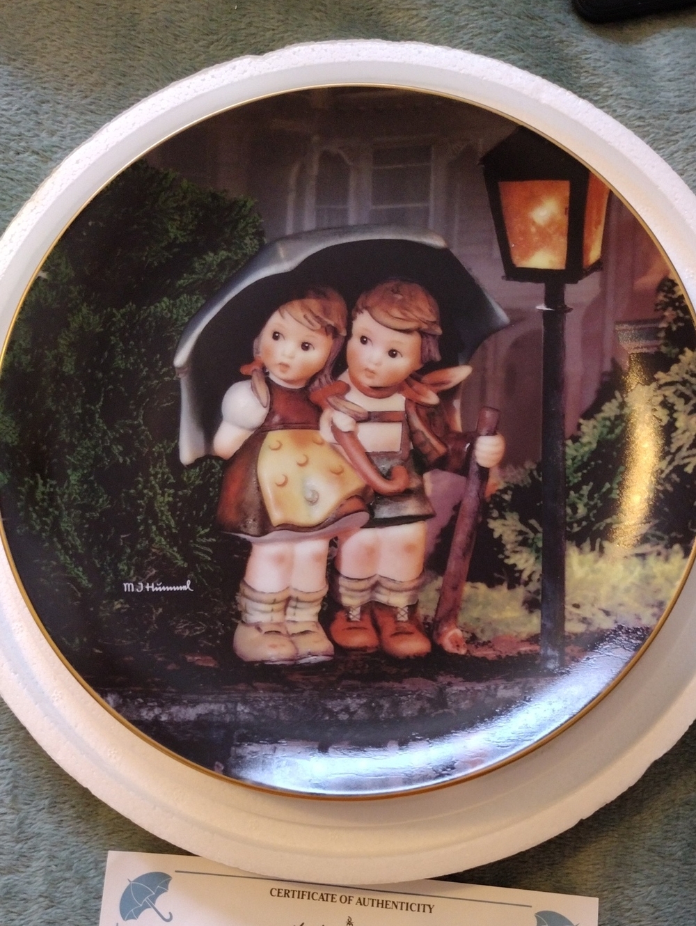 M. J. Hummel Plate "Stormy Weather" Trimmed With 23kt Gold.